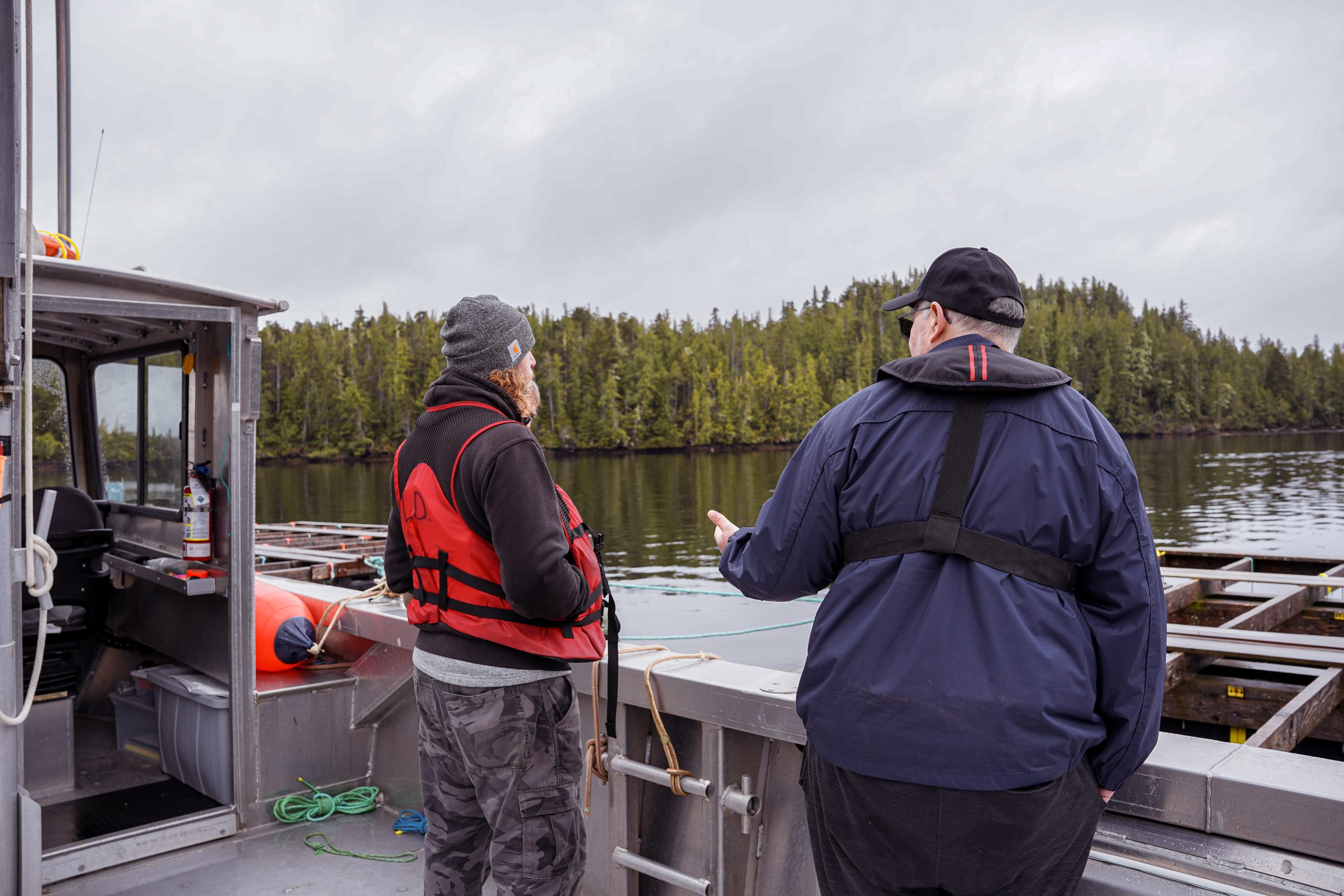 Shellfish workers looking out at the oyster farm.